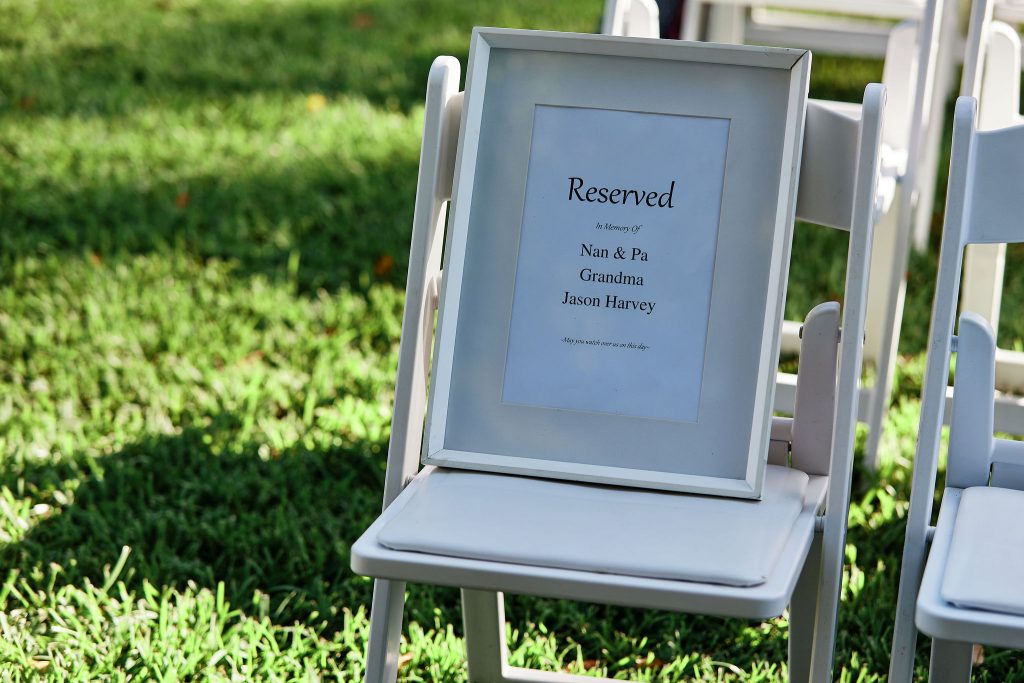 wedding sign acknowledging loved ones that have passed