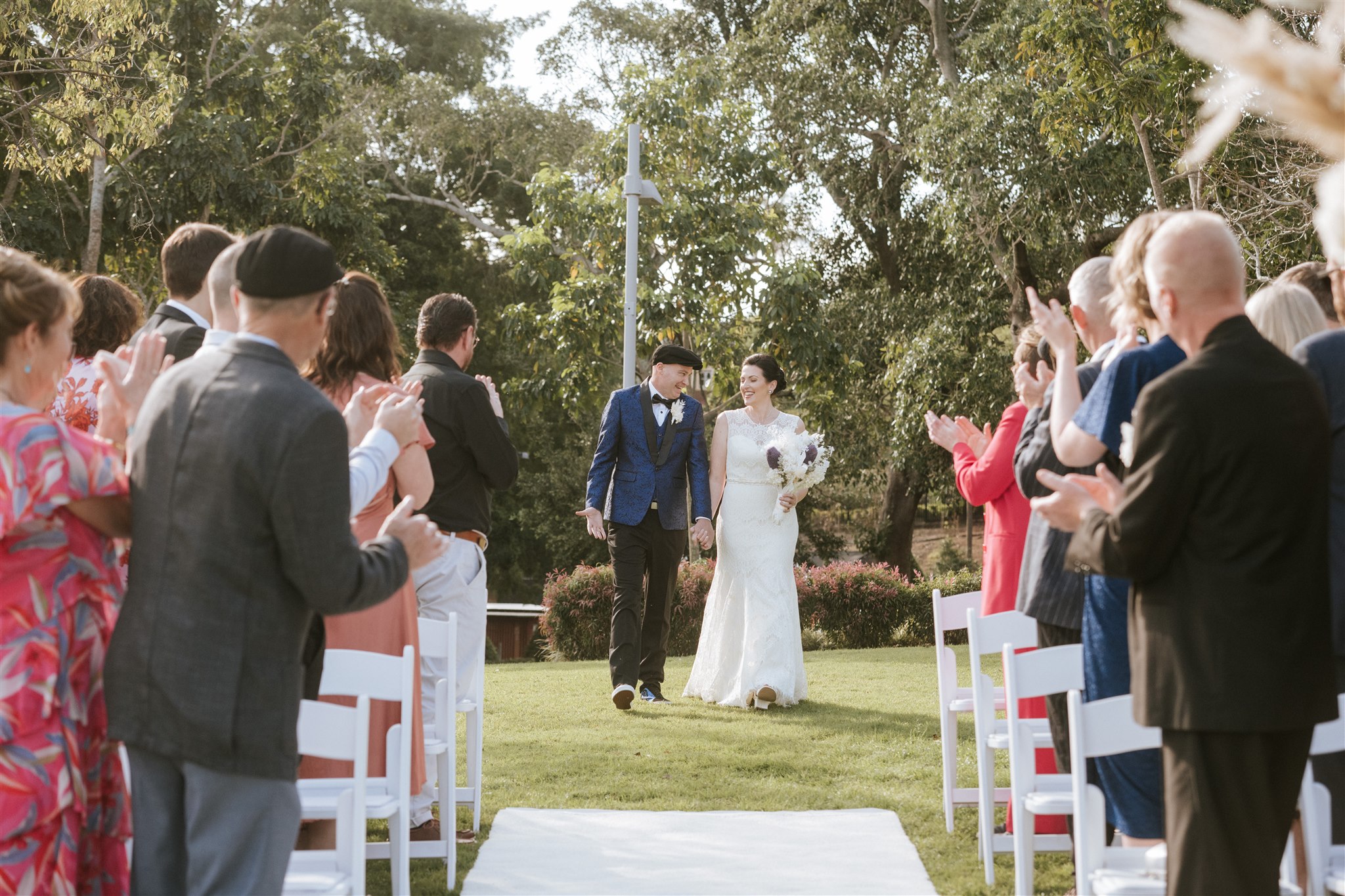 bride and groom walking down the aisle together