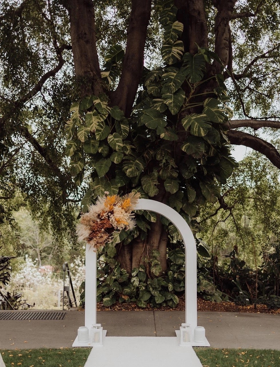 White curved wedding arch hire