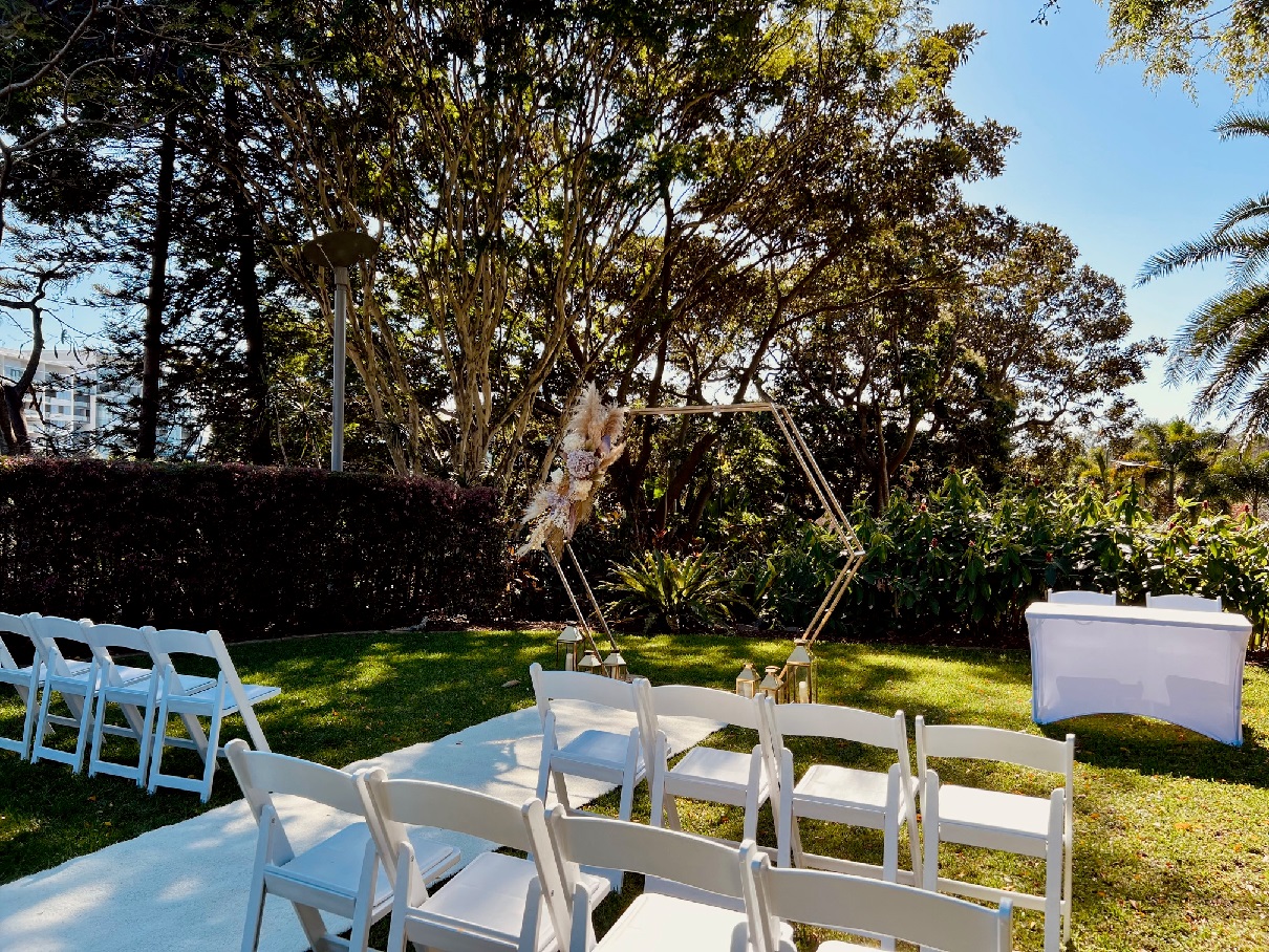 Gold hexagon arbour with lilac flowers