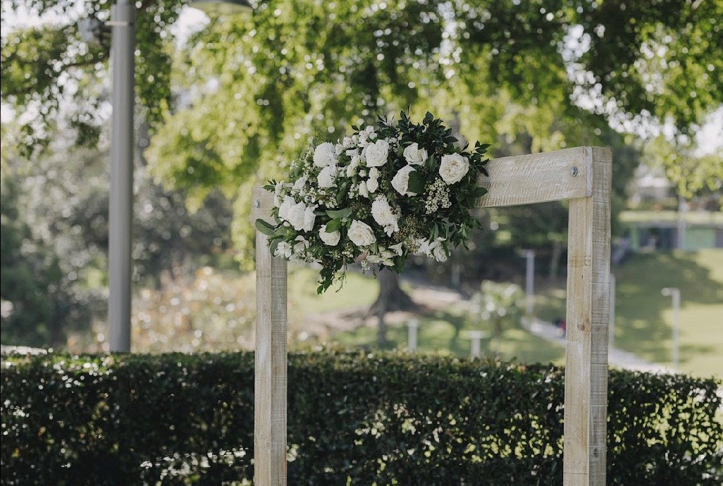 arbour flowers wedding ceremony