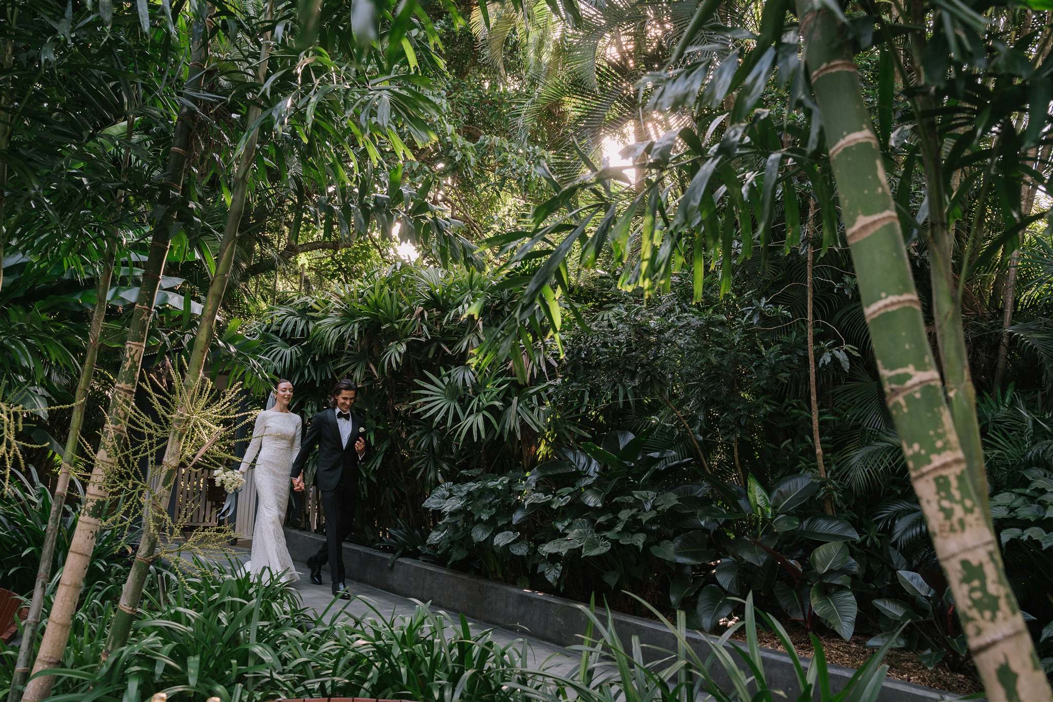 Bride and groom arriving together at Palm Tree Lawn Mt Coot-tha