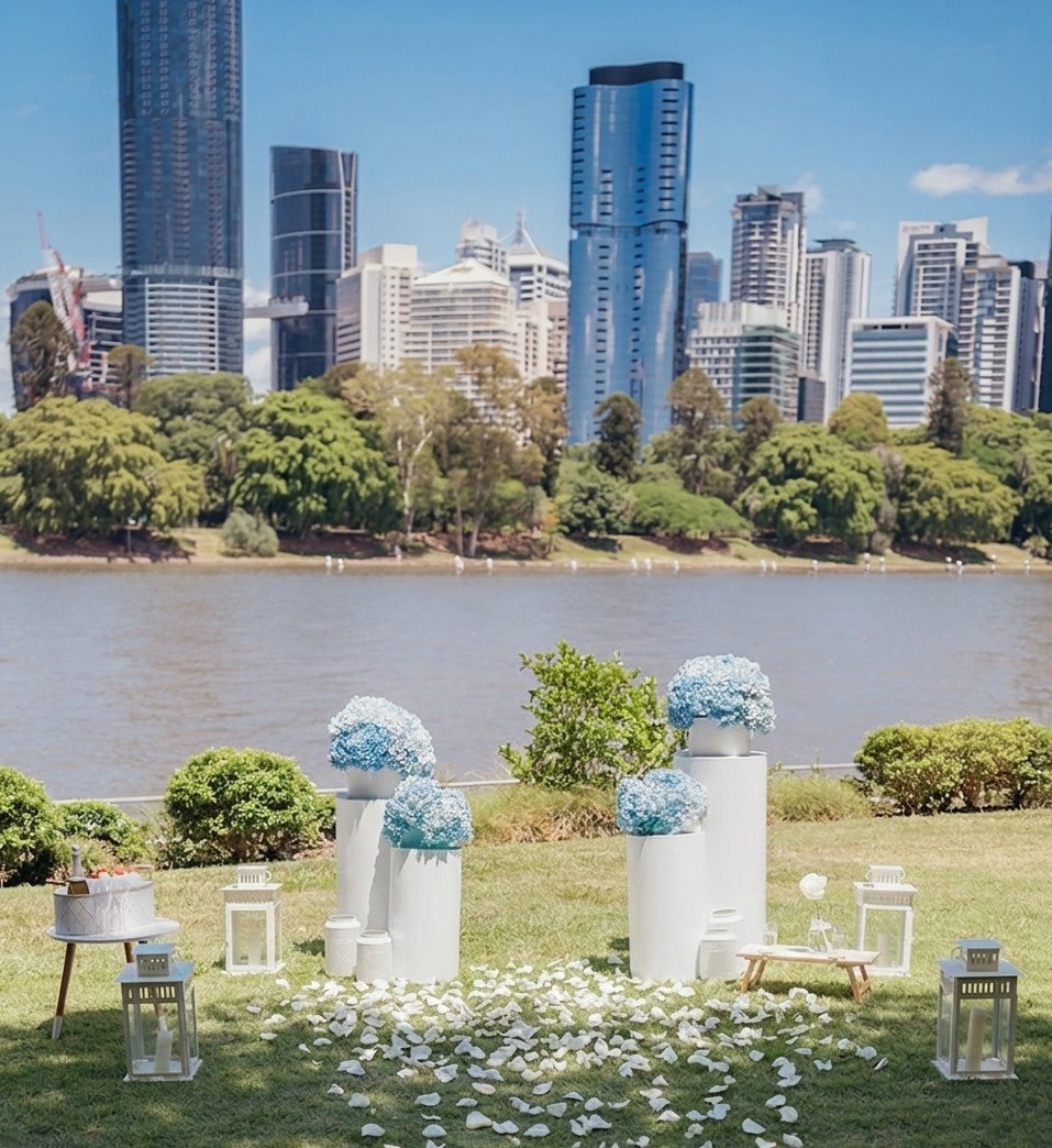 white wedding plinths with soft blue flowers